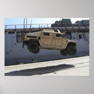 A crane lifts an M998 Humvee Poster