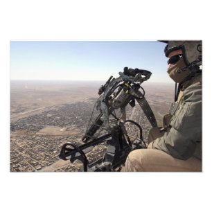 A crew chief looks for suspicious activity photo print