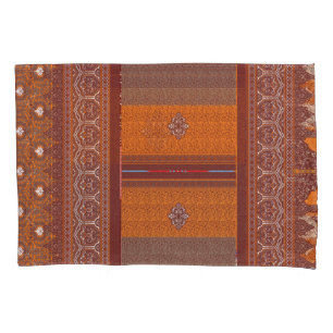 a cross stitch pattern in orange and brown pillowcase