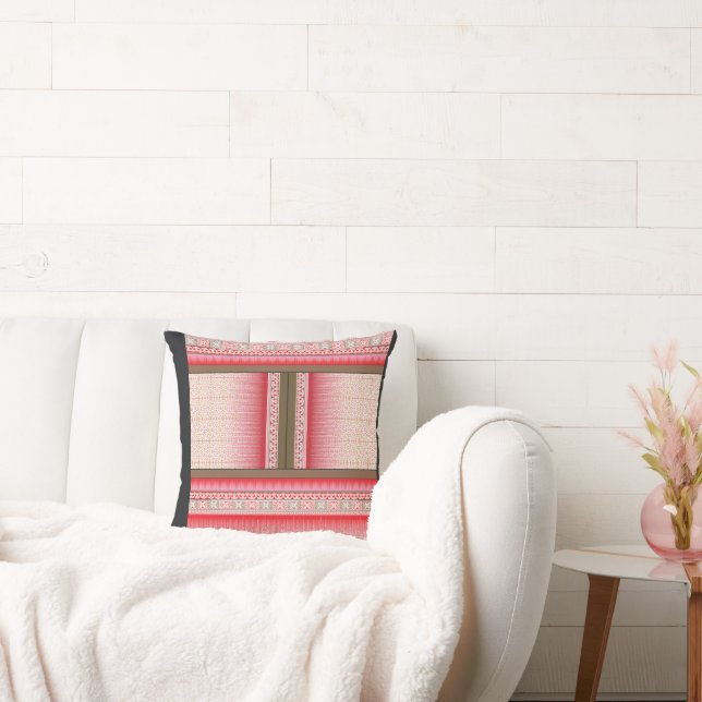 a cross stitch pattern with a red background cushion (Couch)