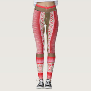 a cross stitch pattern with a red background leggings