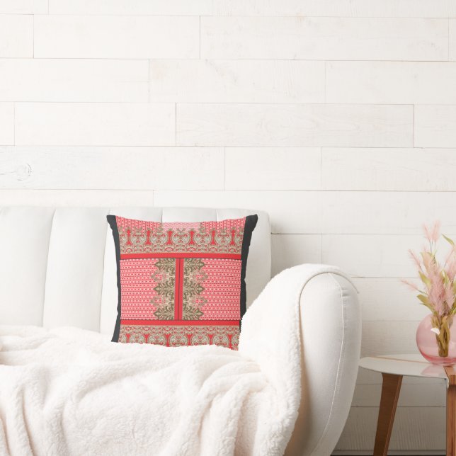 a cross stitch pattern with a red border cushion (Couch)