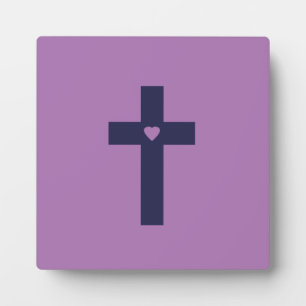 A cross with heart plaque