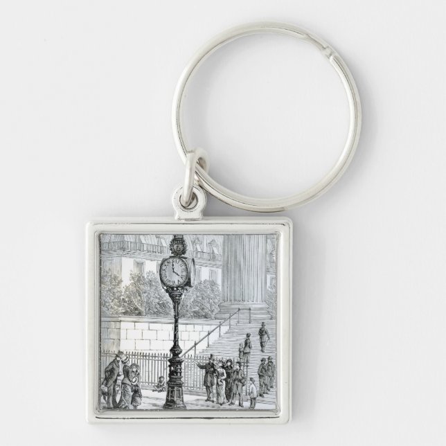 A Crowd Admires a Pneumatic Clock Key Ring (Front)