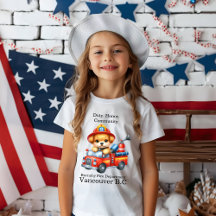 A cute puppy firefighter drives a miniature truck