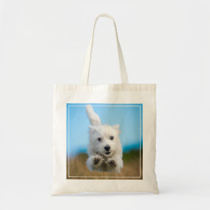 A Cute West Highland Terrier Puppy Running Tote Bag
