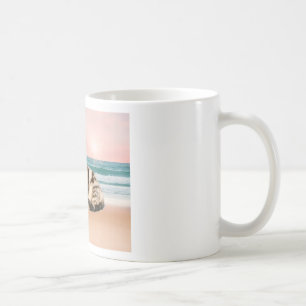 A Cuter Striped Cat Sitting on Beach with sunset Coffee Mug