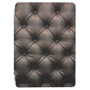 A dark leather cushion background, from a car seat iPad air cover