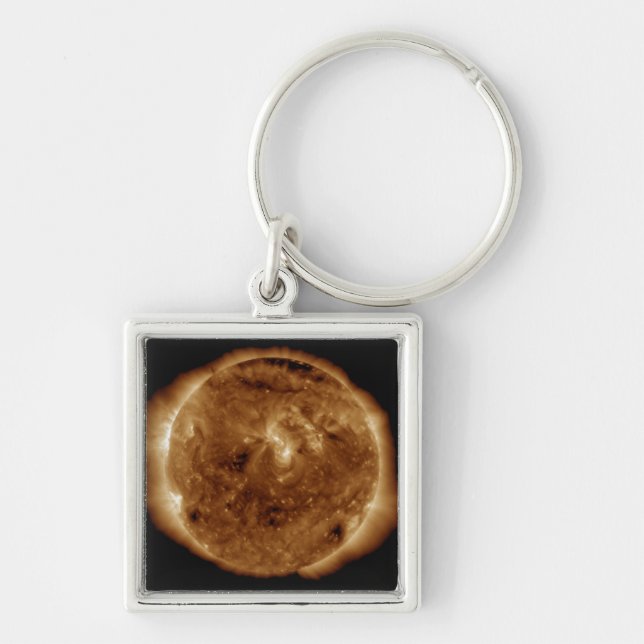 A dark rift in the sun's atmosphere key ring (Front)