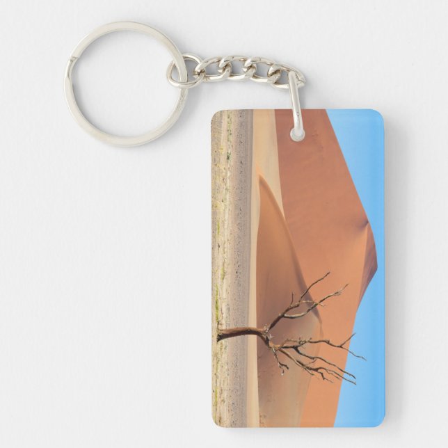 A dead tree on a desert plain with dunes key ring (Front)