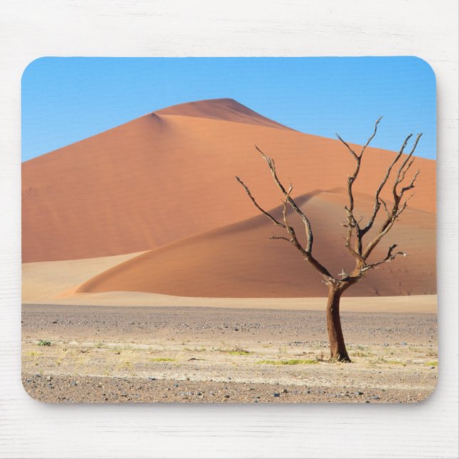 A dead tree on a desert plain with dunes mouse mat (Front)