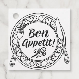 A decorative bon appetit sign with fork and knife favour tags