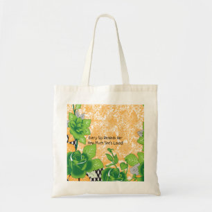 A decorative motif displaying ornate green and ora tote bag