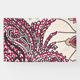 A decorative paisley design with vivid red and pin banner