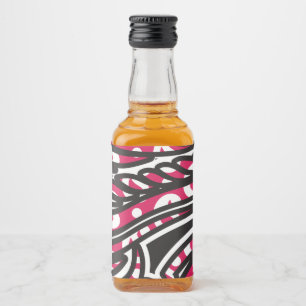 A decorative paisley design with vivid red and pin liquor bottle label