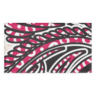 A decorative paisley design with vivid red and pin name tag