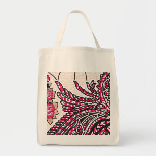 A decorative paisley design with vivid red and pin tote bag