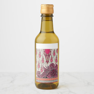 A decorative paisley design with vivid red and pin wine label
