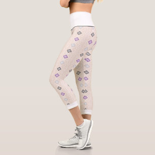 A decorative scarf in rich purple and brown tones, capri leggings