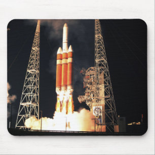 A Delta IV Heavy rocket lifts off Mouse Mat