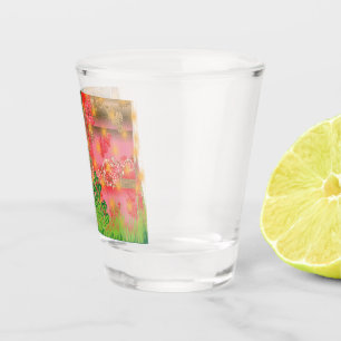 a design of a mirror and some plants shot glass