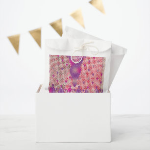 a design of a purple background with dots favour bags