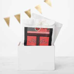 a design of a red and black wallpaper favour bags