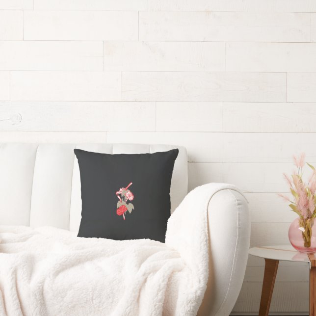 a design of a red flower on a white background cushion (Couch)