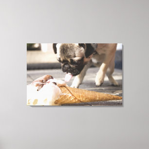 A dog eating an ice cream from a pavement canvas print