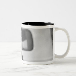 A dog in a car. Two-Tone coffee mug
