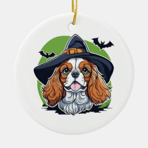 A dog wearing a witches hat with bats ceramic tree decoration