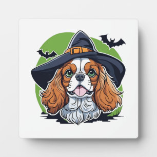 A dog wearing a witches hat with bats plaque