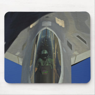 A F-22 Raptor receives fuel from a KC-135 Mouse Mat
