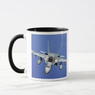 A F/A-18 Hornet participates in a mission Mug