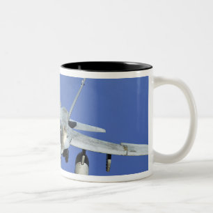 A F/A-18 Hornet participates in a mission Two-Tone Coffee Mug