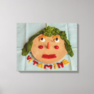 a face  of  vegetables on wrapped canvas
