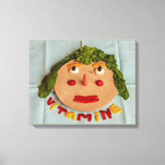 a face  of  vegetables on wrapped canvas
