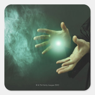 A fantasy wizard making magic with his hands. square sticker