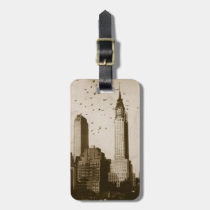 A flock of birds flying luggage tag
