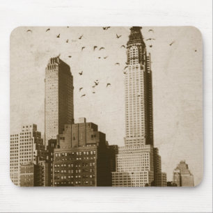 A flock of birds flying mouse mat