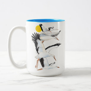 A Flock of White Storks Flying over the Sun Illust Two-Tone Coffee Mug