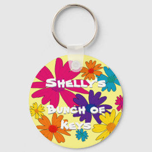 A floral bed of daisy flowers key ring