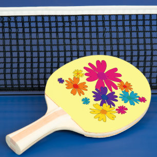A floral bed of daisy flowers ping pong paddle