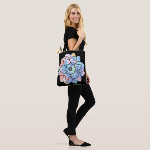 A flower made of paint stains tote bag