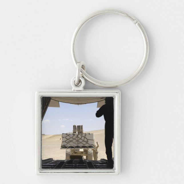 A forklift loads cargo onto a C-130 Hercules Key Ring (Front)