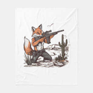 A fox shooting a sniper in the desert fleece blanket