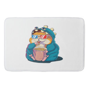 A funny hamster wearing glasses eats popcorn bath mat