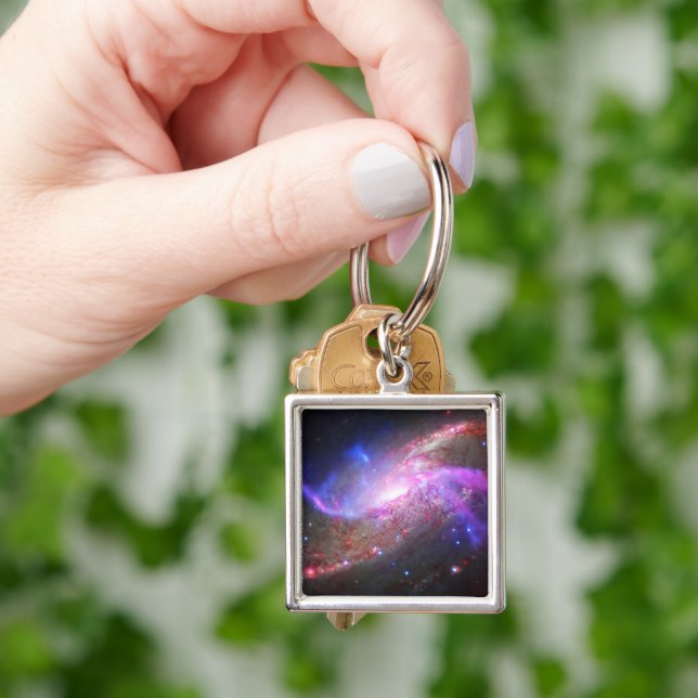 A Galactic Light Show In Spiral Galaxy Ngc 4258. Key Ring (Hand)