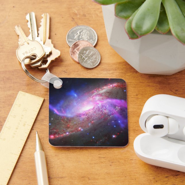 A Galactic Light Show In Spiral Galaxy Ngc 4258. Key Ring (Desk)