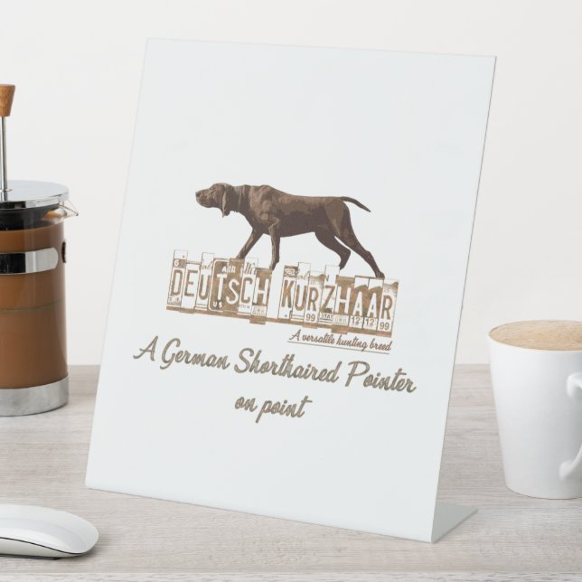 A German Shorthaired Pointer on point  Pedestal Sign (In SItu)
